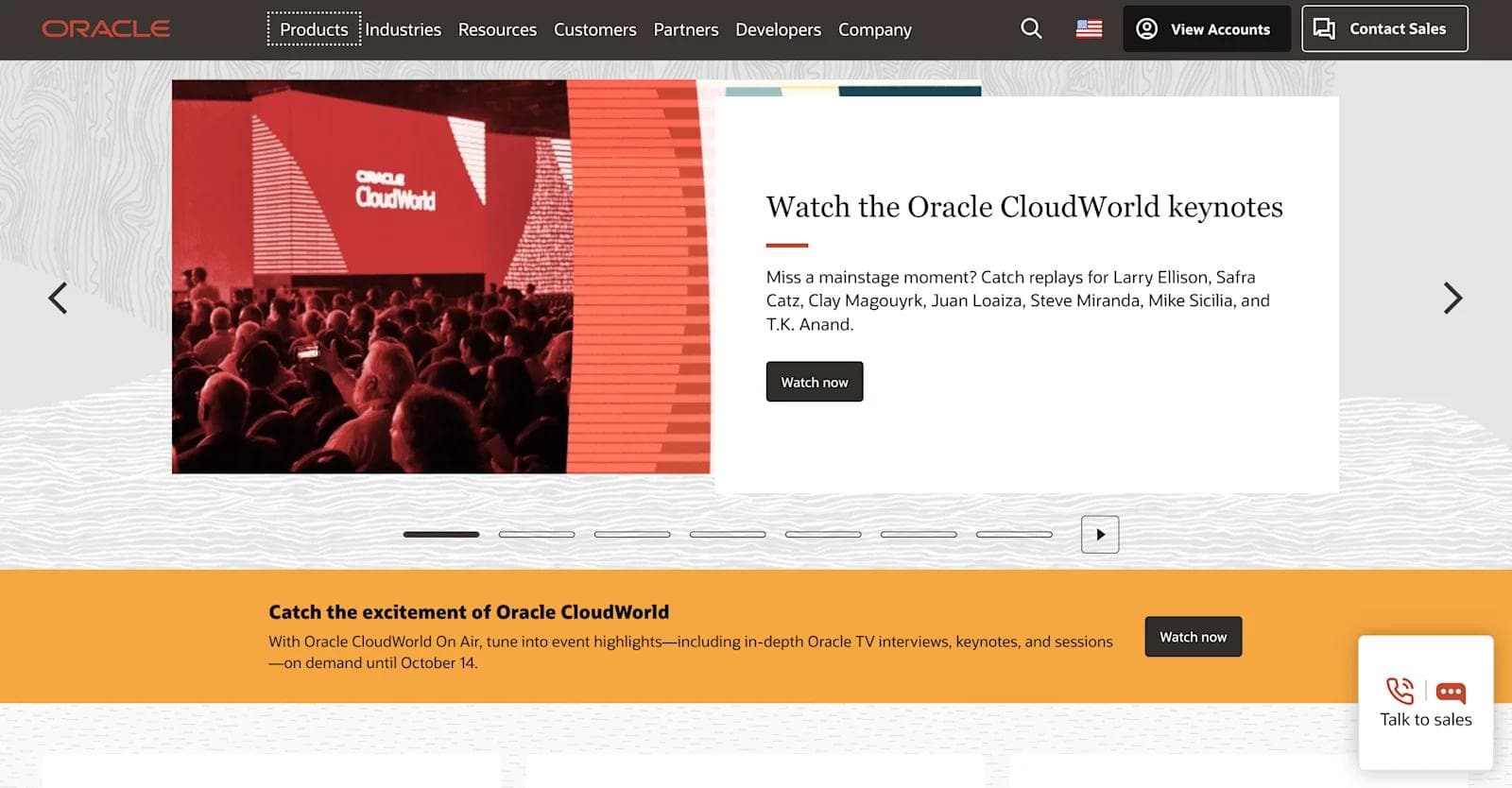 oracle website Audience attending Oracle CloudWorld event, featuring a prominent presentation screen displaying "Oracle CloudWorld."