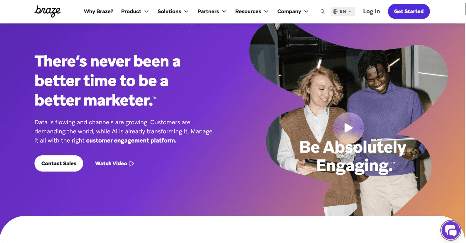 braze homepage Marketing-focused webpage showcasing a diverse team engaged with digital devices, featuring a call to action.