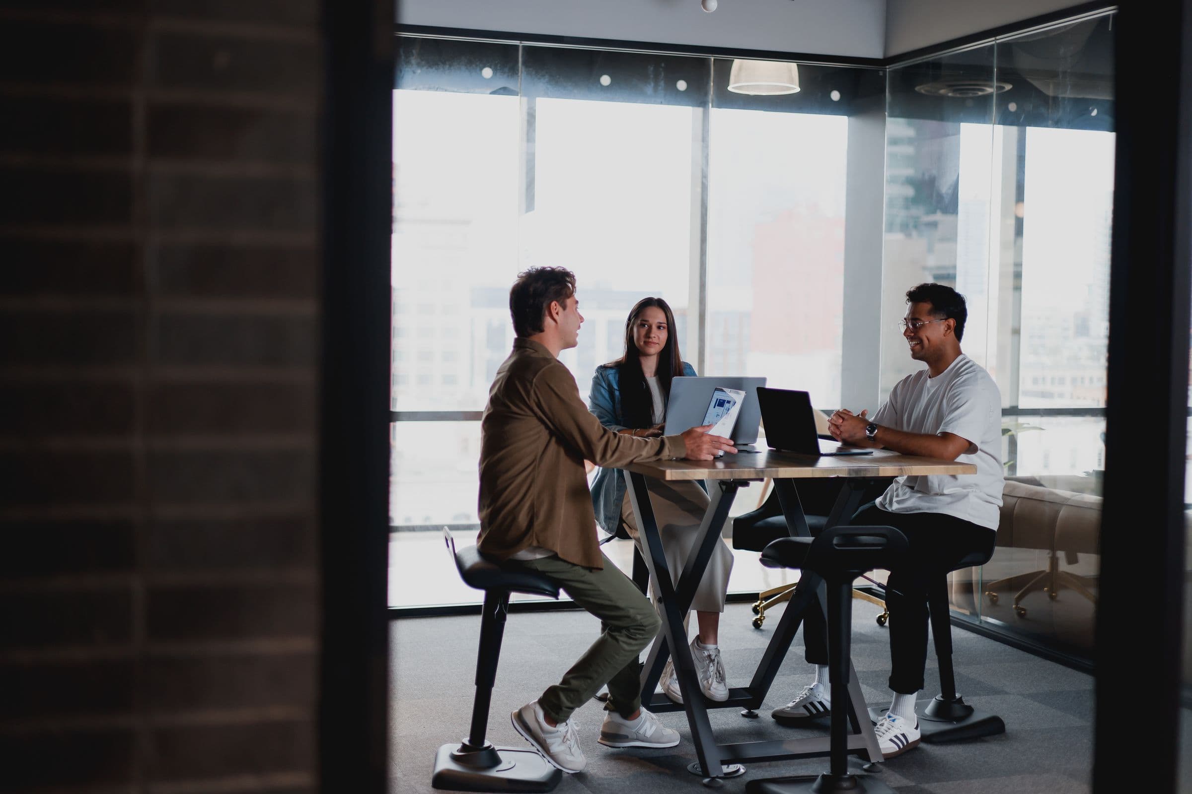 Website product team collaborating on a laptop