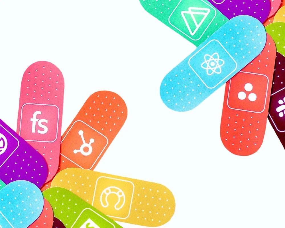 tech-stack-stickers A custom illustration of colorful bandaids representing different technologies.