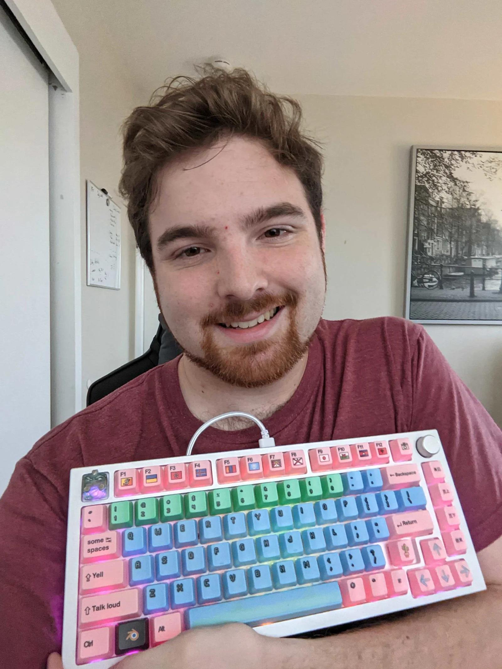 Image of Matthew Gasin and a custom built keyboard.