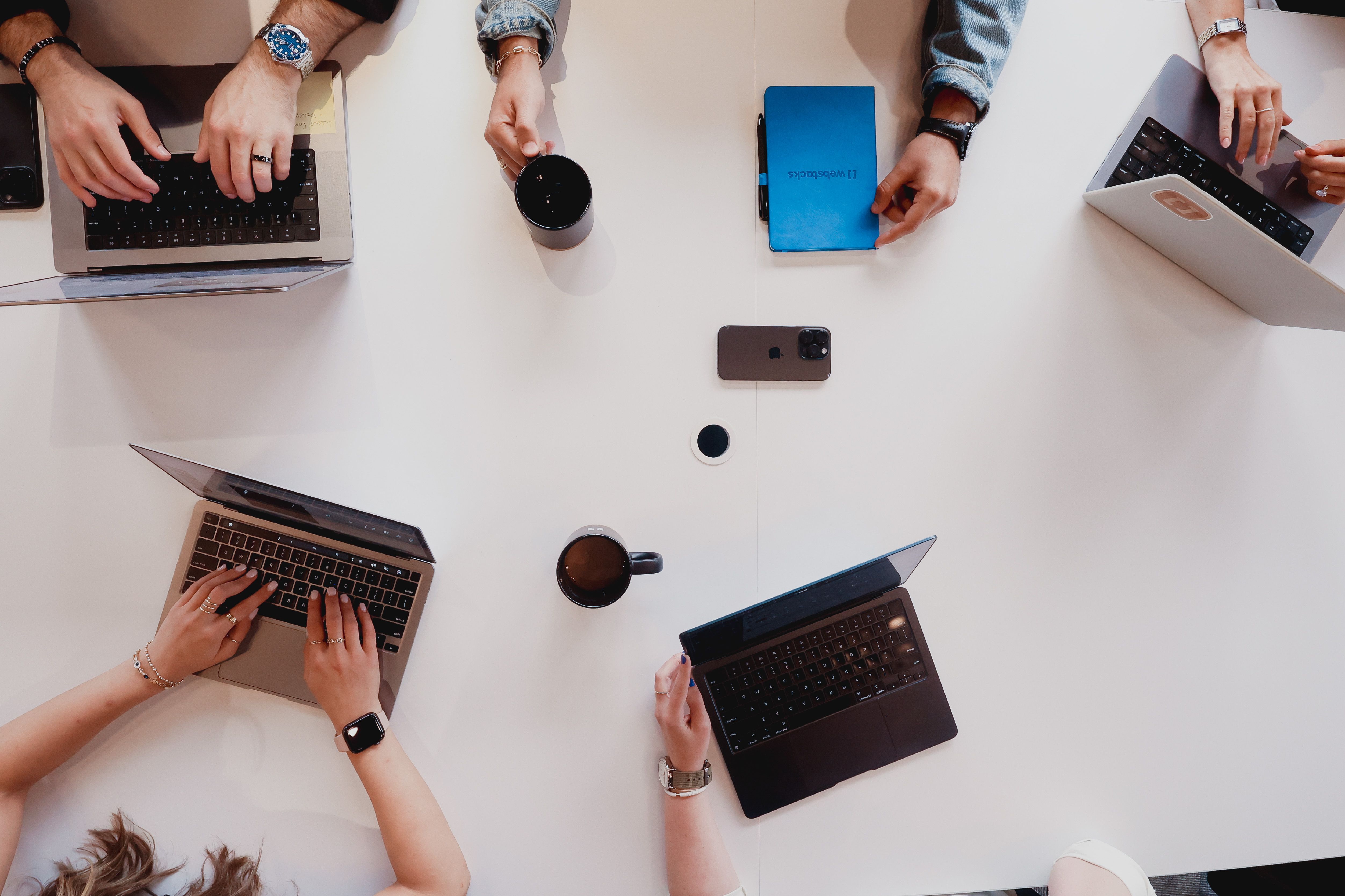 Web team collaborating at a conference table